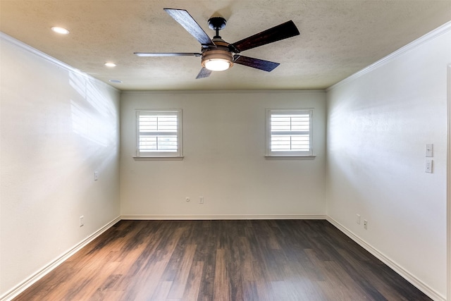 empty room with ornamental molding, a healthy amount of sunlight, dark wood-type flooring, and a textured ceiling