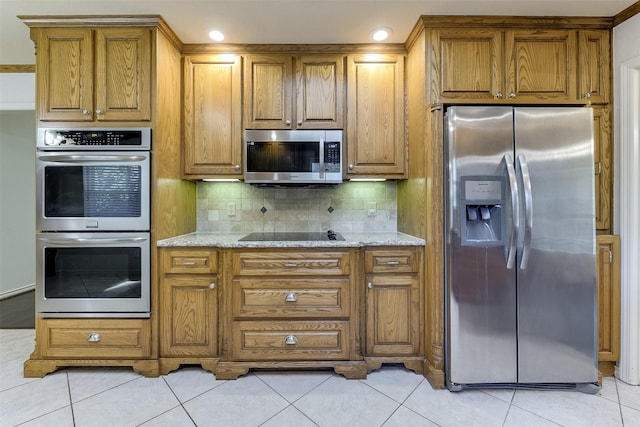 kitchen with brown cabinetry and stainless steel appliances