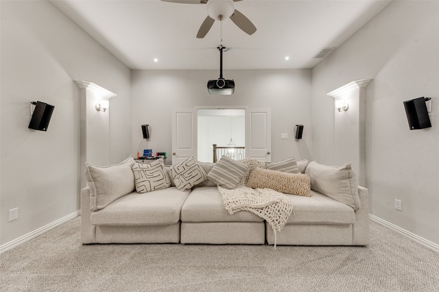 carpeted cinema with ceiling fan