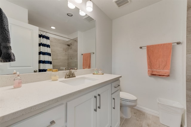 bathroom with walk in shower, vanity, tile patterned flooring, and toilet