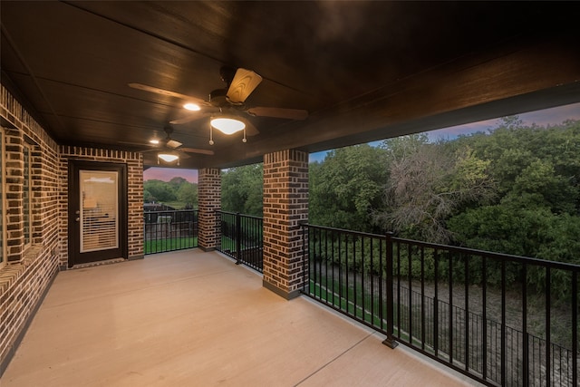 balcony at dusk with ceiling fan