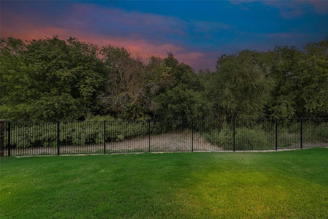 view of yard at dusk