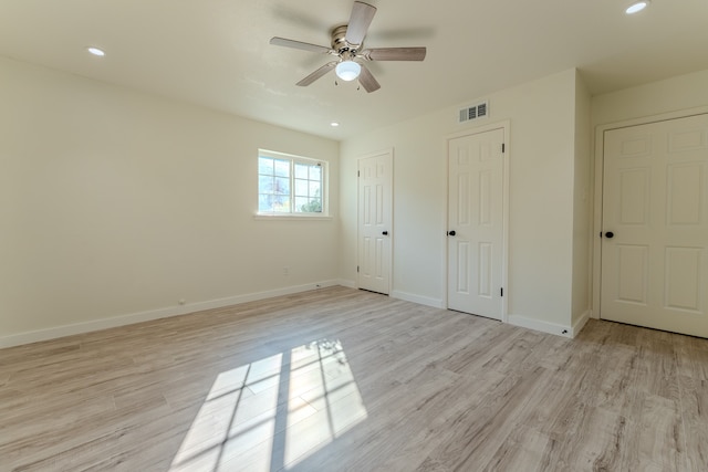 unfurnished bedroom featuring ceiling fan and light hardwood / wood-style floors