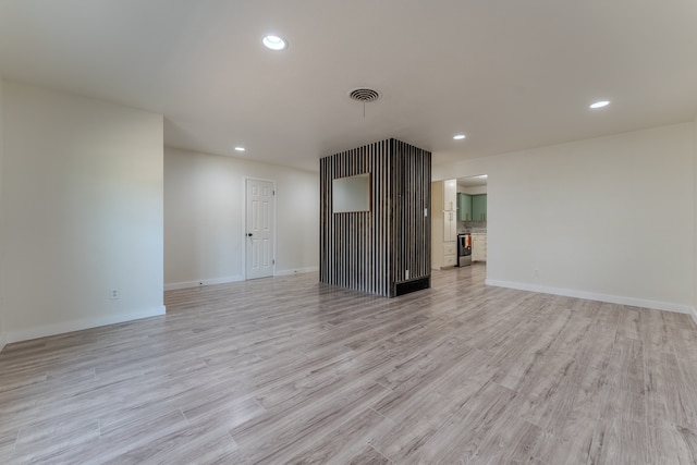 unfurnished living room with light hardwood / wood-style floors