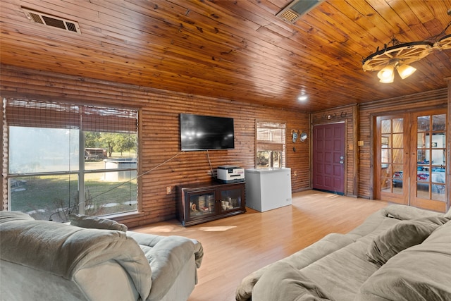 living room with french doors, light hardwood / wood-style floors, and wood ceiling