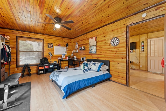 bedroom featuring hardwood / wood-style flooring, wood walls, and wooden ceiling