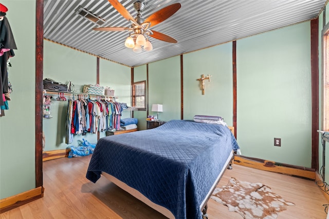 bedroom featuring light wood-type flooring and ceiling fan