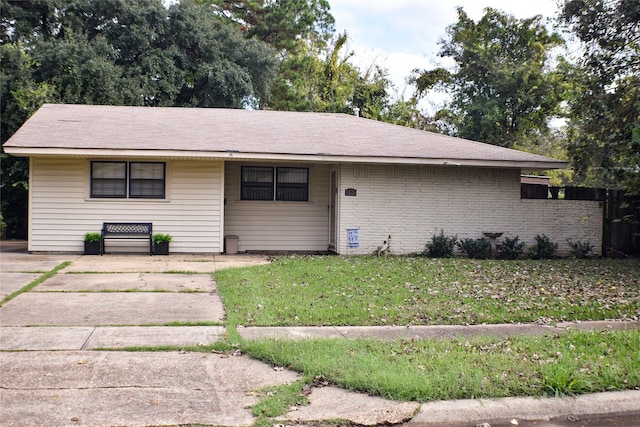 view of front of home with a front yard