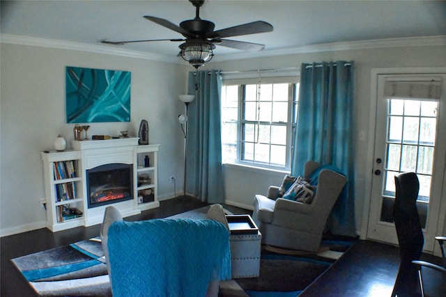 living room with dark hardwood / wood-style flooring, ceiling fan, and ornamental molding