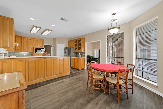 dining room featuring dark hardwood / wood-style flooring