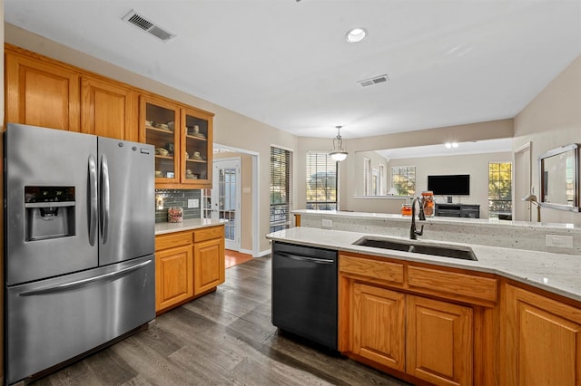 kitchen with stainless steel appliances, dark hardwood / wood-style floors, a healthy amount of sunlight, and sink