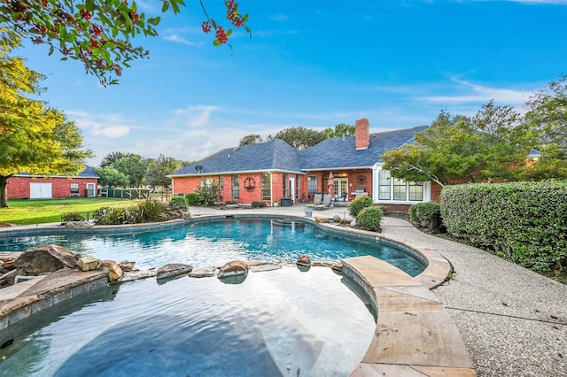 view of swimming pool with a patio area