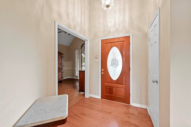 foyer featuring hardwood / wood-style floors and lofted ceiling