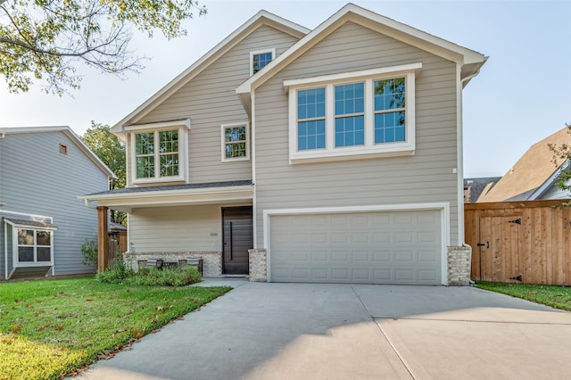 view of front facade featuring a front yard and a garage