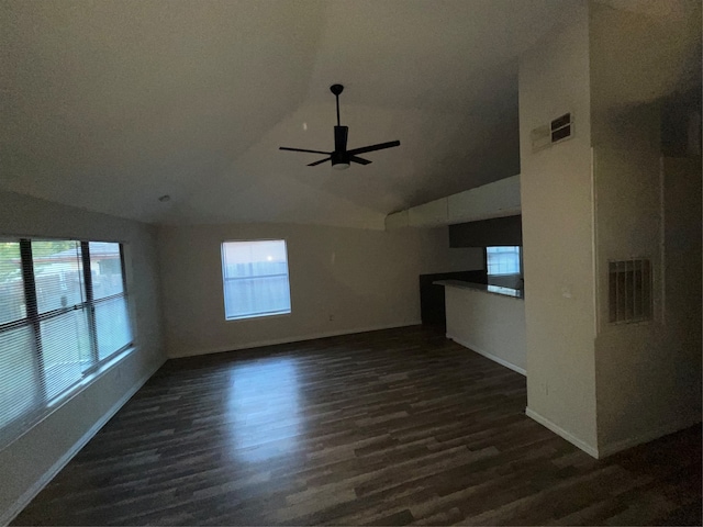 unfurnished living room featuring lofted ceiling, ceiling fan, and dark hardwood / wood-style flooring