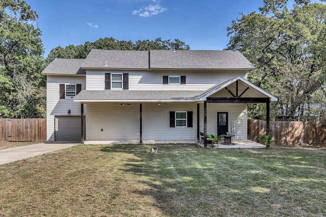 view of front of home with a front lawn and a garage