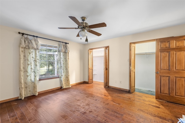 unfurnished bedroom featuring ceiling fan and hardwood / wood-style flooring