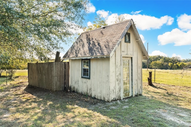 view of outbuilding featuring a lawn