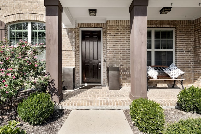 doorway to property with covered porch