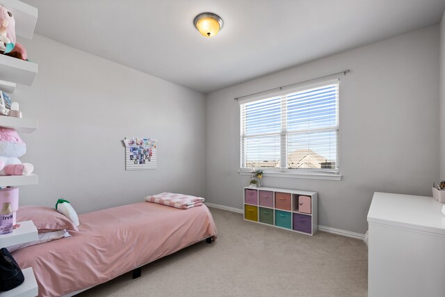 bedroom with light colored carpet