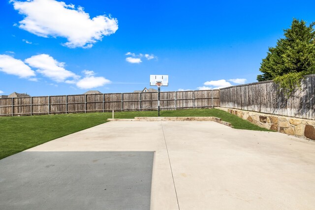 view of patio with basketball hoop