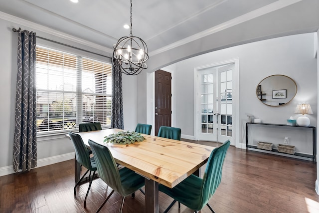 dining room featuring a chandelier, dark hardwood / wood-style floors, and crown molding