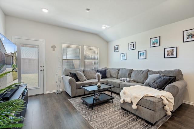 living room featuring dark wood-type flooring and lofted ceiling