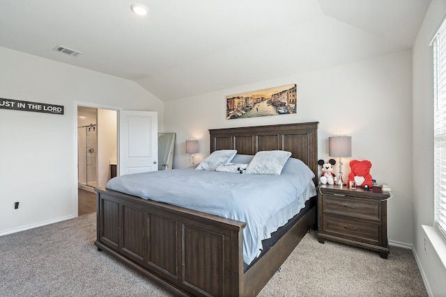 carpeted bedroom with lofted ceiling and connected bathroom