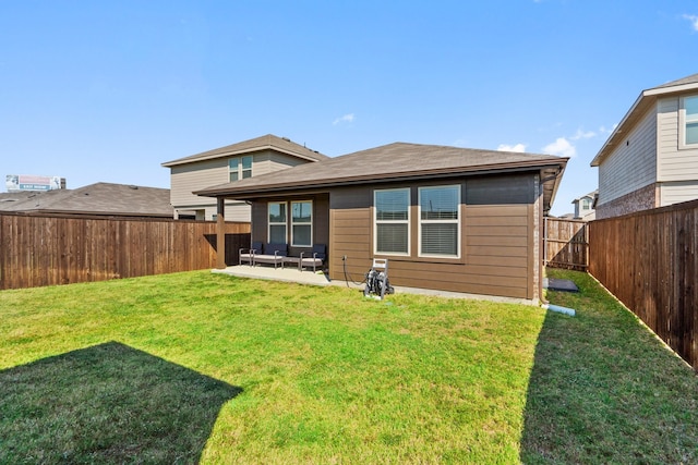 back of house featuring a yard and a patio