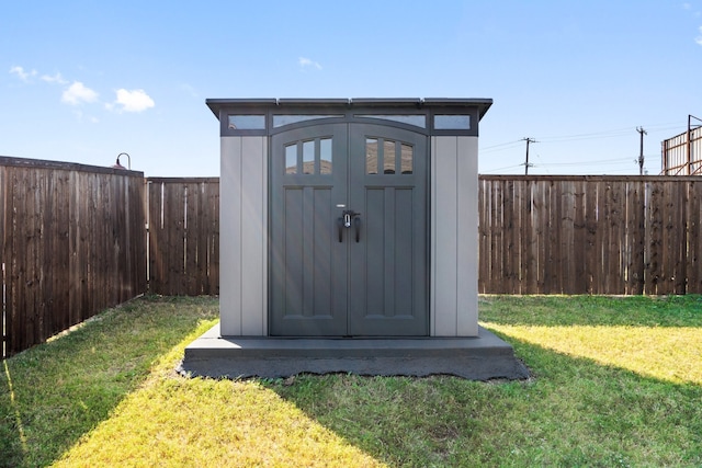 view of outbuilding featuring a yard