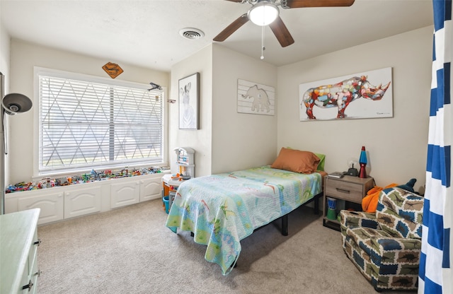 carpeted bedroom featuring ceiling fan