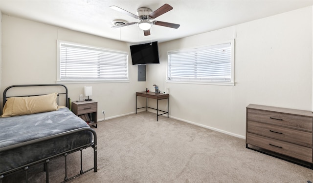 bedroom featuring light carpet and ceiling fan