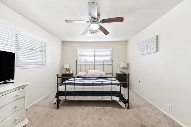 bedroom with light carpet and ceiling fan