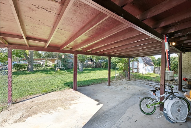 view of patio / terrace featuring a storage shed