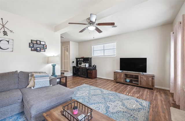 living room featuring dark wood-type flooring and ceiling fan