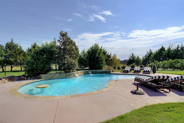 view of swimming pool with a patio and pool water feature