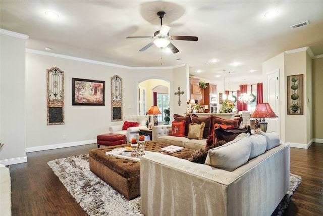 living room with ceiling fan, dark hardwood / wood-style floors, and crown molding