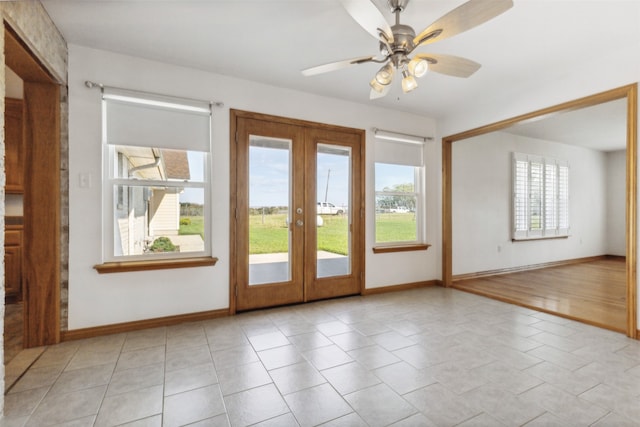 doorway to outside featuring a healthy amount of sunlight, ceiling fan, french doors, and light hardwood / wood-style flooring