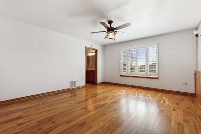 empty room with light hardwood / wood-style floors and ceiling fan