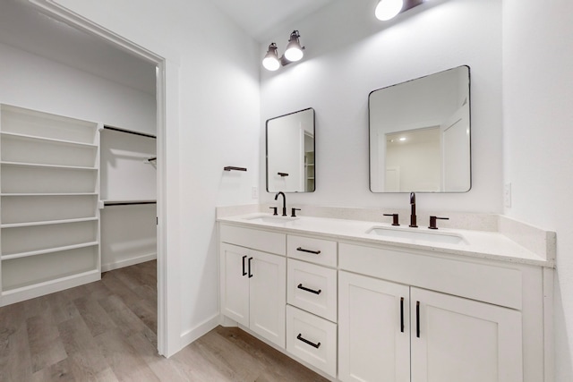 bathroom featuring vanity and hardwood / wood-style flooring