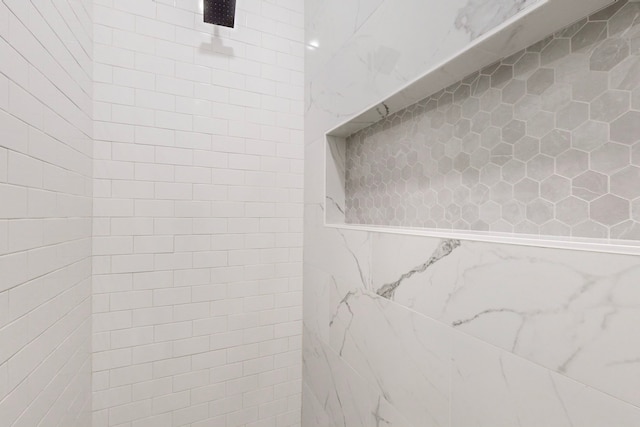 room details featuring tiled shower