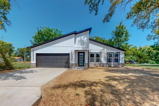 modern farmhouse with a garage