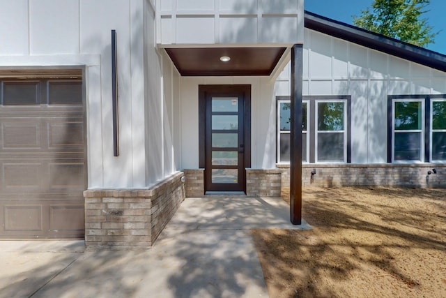 view of exterior entry featuring a garage