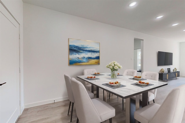 dining room featuring light hardwood / wood-style flooring