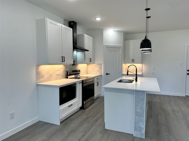 kitchen with white cabinets, hanging light fixtures, and electric range