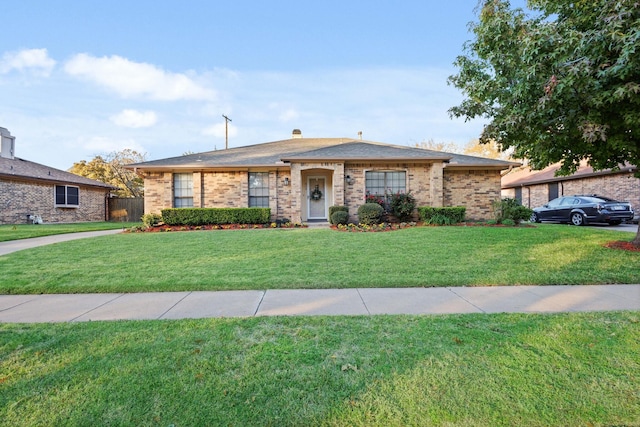 ranch-style home with a front yard