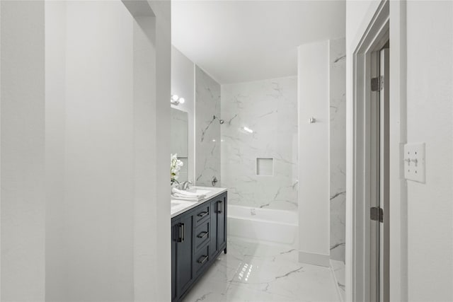 bathroom with vanity and tiled shower / bath combo