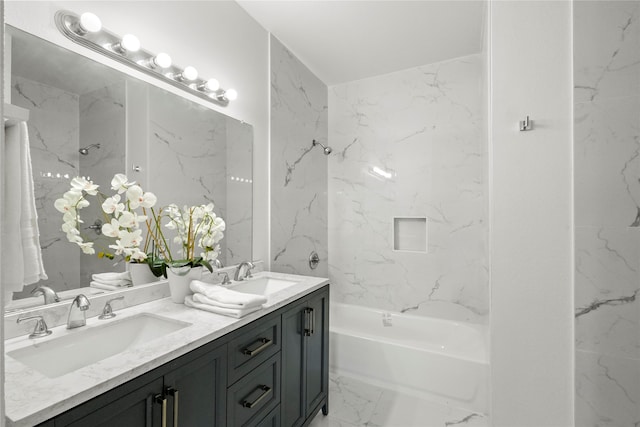 bathroom featuring vanity and tiled shower / bath combo