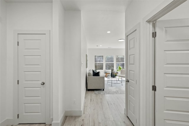 hall with light hardwood / wood-style flooring