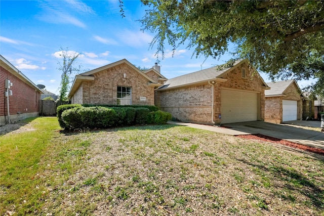 ranch-style house with a garage and a front lawn